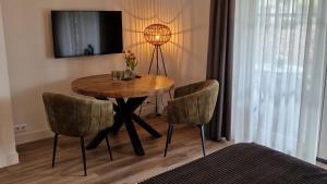 TV a/nebo společenská místnost v ubytování B&B De Droomhoeve