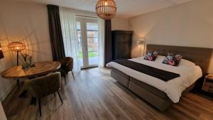 Postel nebo postele na pokoji v ubytování B&B De Droomhoeve + 37 fotografií