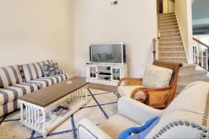 a living room with two couches and a tv at 38815 Cedar Waxwing La Bay Forest Bethany in Ocean View