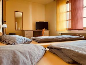 Postel nebo postele na pokoji v ubytování Zum Alten Krug