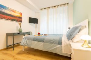 A bed or beds in a room at Italianflat - Vittoria Suite