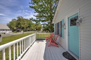a porch with a red chair on a house at 528 Candlelight Ln, Bethany Beach in Bethany Beach