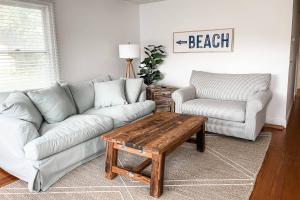 a living room with a couch and a coffee table at 528 Candlelight Ln, Bethany Beach in Bethany Beach +36 photos