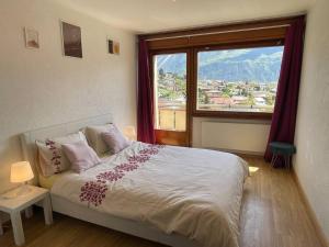 Ліжко або ліжка в номері Spacieux, situation idéale pour visiter le Valais