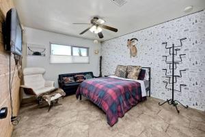 a bedroom with a bed and a ceiling fan at Your Private Resort near Coast in Oceanside +23 photos