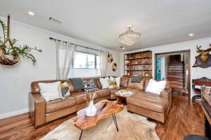 a living room with a couch and a table at Your Private Resort near Coast in Oceanside