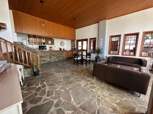 a large living room with a couch and a table at To Kyma in Amarinthos