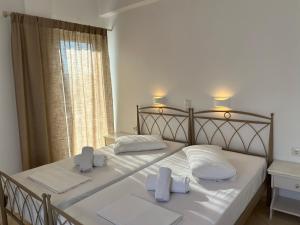 Postel nebo postele na pokoji v ubytování Hotel Chrisoula