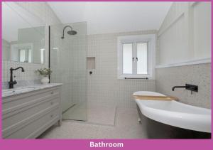 a white bathroom with a sink and a shower at Harold Street 139 in Townsville