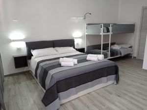 Postel nebo postele na pokoji v ubytování Ciccina Rooms