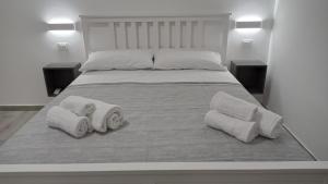Postel nebo postele na pokoji v ubytování Ciccina Rooms