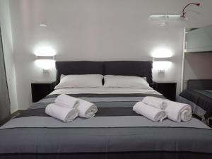 Postel nebo postele na pokoji v ubytování Ciccina Rooms