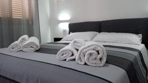 Postel nebo postele na pokoji v ubytování Ciccina Rooms