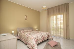 Ένα ή περισσότερα κρεβάτια σε δωμάτιο στο Sicilia bedda house