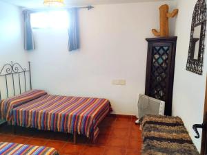 Postel nebo postele na pokoji v ubytování La Casita de Piedra