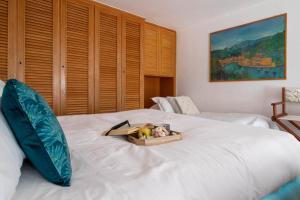 A bed or beds in a room at Vicoletto by PortofinoHomes