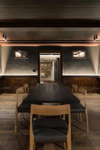 a dining room with a table and chairs at Pazo da Buzaca in Moraña