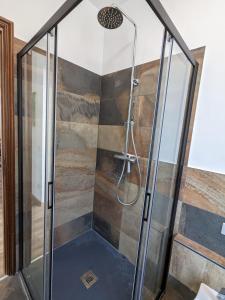 a shower with a glass enclosure in a bathroom at Maison Alice in Saint Vincent +58 photos