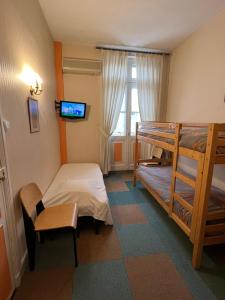 Postel nebo postele na pokoji v ubytování Hotel Montsegur
