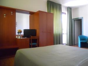 Postel nebo postele na pokoji v ubytování Hotel Traghetto
