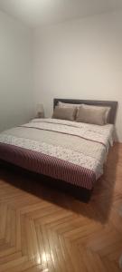 Ένα ή περισσότερα κρεβάτια σε δωμάτιο στο Apartman Stojanovic