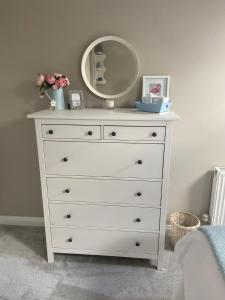 a white dresser with a mirror on top of it at The Barn in Bishops Tachbrook