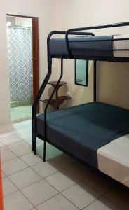 a bunk bed in a room with a window at Riveri Salinas V53 in Salinas
