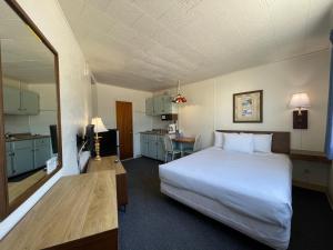 a hotel room with a bed and a kitchen at Bel Air Motel in Wildwood Crest