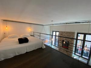 Posteľ alebo postele v izbe v ubytovaní MAR1 - Studio loft avec couchage en mezzanine, centre ville