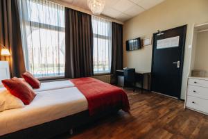 Postel nebo postele na pokoji v ubytování Hotel Renesse