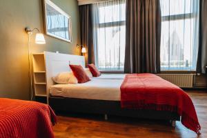 Postel nebo postele na pokoji v ubytování Hotel Renesse
