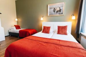 Postel nebo postele na pokoji v ubytování Hotel Renesse