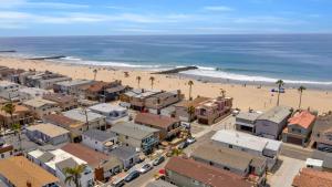 an aerial view of a beach with buildings and palm trees at 114 Forty-Second Street A in Newport Beach