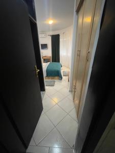 Ένα ή περισσότερα κρεβάτια σε δωμάτιο στο Guest House-MD