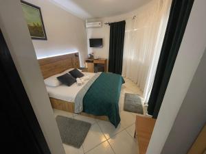 Ένα ή περισσότερα κρεβάτια σε δωμάτιο στο Guest House-MD