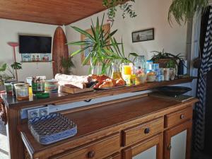 a table with food and drinks on top of it at Guesthouse Évasion in Contis-les-Bains