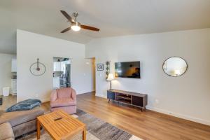 a living room with a couch and a table at Pet-Friendly Phoenix Vacation Rental Pool Access! in Phoenix
