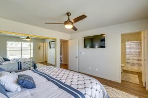 a bedroom with two beds and a ceiling fan at Pet-Friendly Phoenix Vacation Rental Pool Access! in Phoenix
