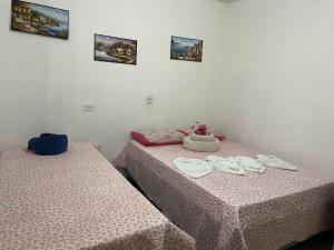Postel nebo postele na pokoji v ubytování Cantinho da mery 1