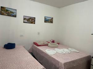 Postel nebo postele na pokoji v ubytování Cantinho da mery 1