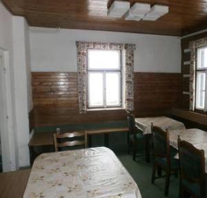 Postel nebo postele na pokoji v ubytování Horská chata Roubenka
