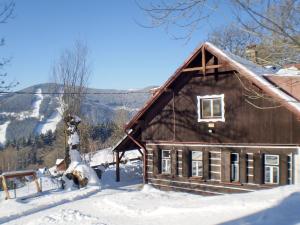 Horská chata Roubenka under vintern