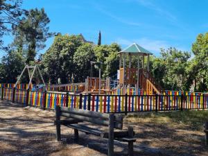 a park with a playground with a roller coaster at Aroeira Lisbon Golf & Beach in Charneca