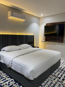 Postel nebo postele na pokoji v ubytování فندق قمم بارك Qimam Park Hotel 4