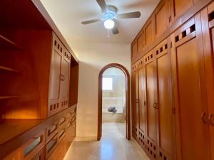 a kitchen with a ceiling fan and an archway at Villa Navarro: Marina Vallarta in Puerto Vallarta