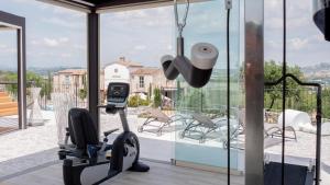 a room with a gym with a view of a house at Villa Sant'Angelo in Alba Adriatica