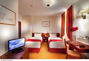 Ein Bett oder Betten in einem Zimmer der Unterkunft Hotel AlaGare