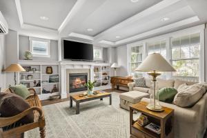 a living room with a couch and a fireplace at Waverly Place in Portland
