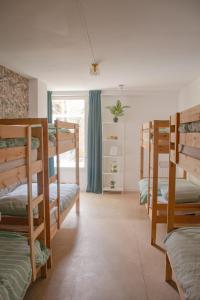 a room with four bunk beds and a window at Hostel Barbarossa in Nijmegen