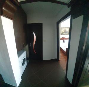a laundry room with a washing machine and a window at Blue Sky Apartament in Constanţa
